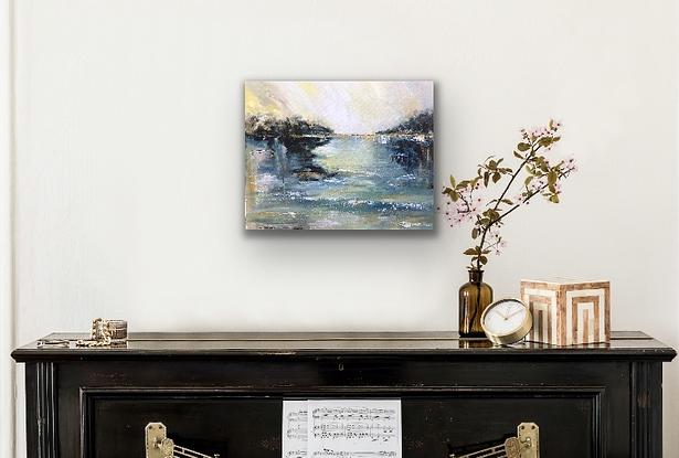 A soft watery view of a river inlet alive with light and energy. Soothing and dreamy. The colours are softly muted ad flow in the water into dreamy reflections. This is a soothing piece that will add sparkle and beauty to your room with its soaring sky and gentle water movements.