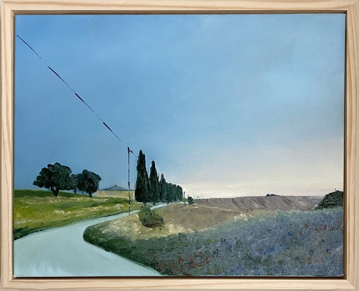 Dusk light on a farmhouse with cypress trees lining a dirt road