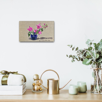 Pink Bougainvillea flower on raw linen backdrop