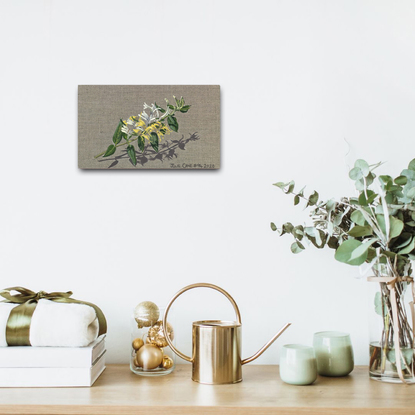 Japanese Honeysuckle flowers on raw linen backdrop.