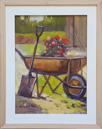 Simple garden scene with a wheelbarrow and flowers 