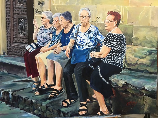 Five Italian  nonnas sitting  on a stone bench near Santo Spirito in Oltrano, Florence, Italy. 